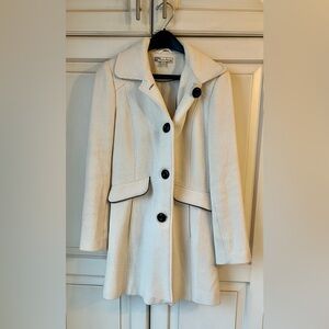 American Rag Y2K coat. Beautiful cream jacket with black trim. Wool/rayon blend
